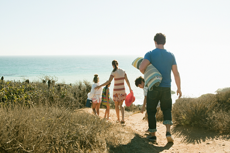 a family going on a walk at the beach